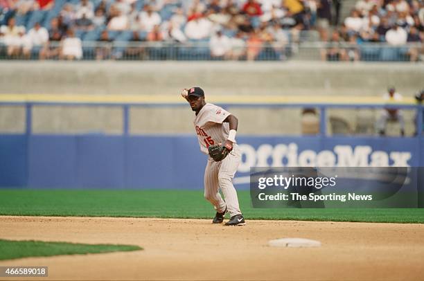 Cristian Guzman of the Minnesota Twins fields against the Chicago White Sox on April 21, 2001 at Comiskey Park II in Chicago, Illinois. The Twins won...
