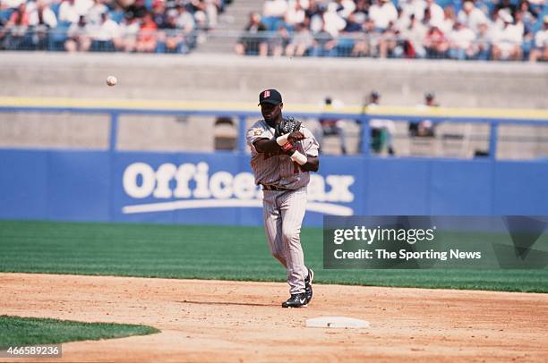 Cristian Guzman of the Minnesota Twins fields against the Chicago White Sox on April 21, 2001 at Comiskey Park II in Chicago, Illinois. The Twins won...
