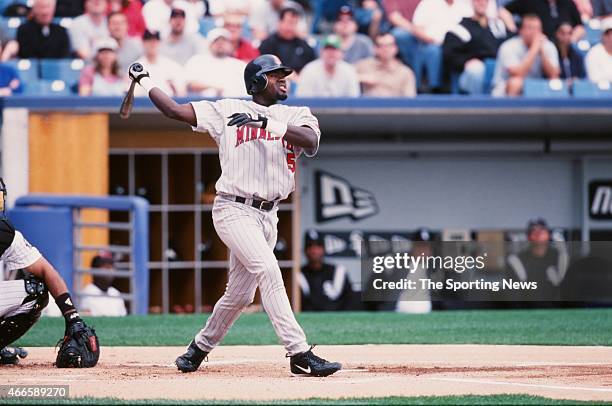 Cristian Guzman of the Minnesota Twins bats against the Chicago White Sox on April 21, 2001 at Comiskey Park II in Chicago, Illinois. The Twins won...