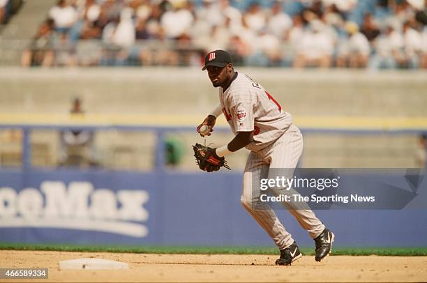 Cristian Guzman of the Minnesota Twins fields against the Chicago White Sox on April 21, 2001 at Comiskey Park II in Chicago, Illinois. The Twins won...