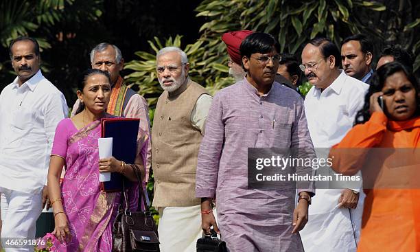 Prime Minister Narendra Modi with party MPs after the BJP parliamentary board meeting at Parliament House on March 17, 2015 in New Delhi, India. The...