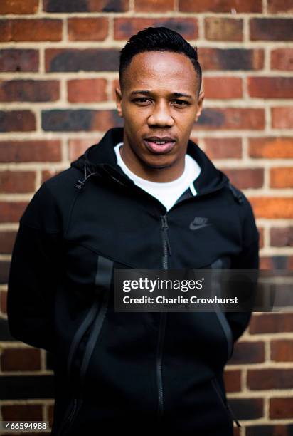 Nathaniel Clyne poses for a photo during the Premier League Players Kit Scheme Launch at Allen Edward Primary School on March 17, 2015 in London,...