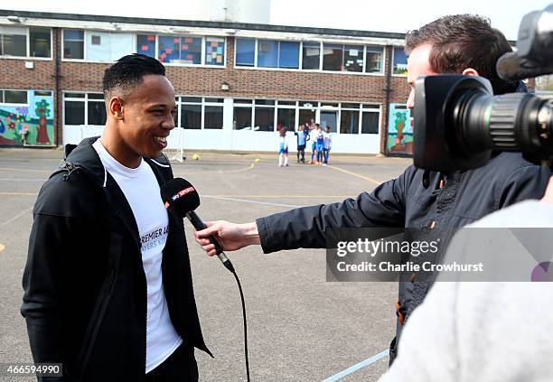 Nathaniel Clyne chats to media during the Premier League Players Kit Scheme Launch at Allen Edward Primary School on March 17, 2015 in London,...