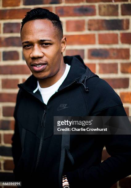 Nathaniel Clyne poses for a photo during the Premier League Players Kit Scheme Launch at Allen Edward Primary School on March 17, 2015 in London,...