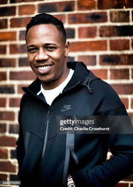 Nathaniel Clyne poses for a photo during the Premier League Players Kit Scheme Launch at Allen Edward Primary School on March 17, 2015 in London,...