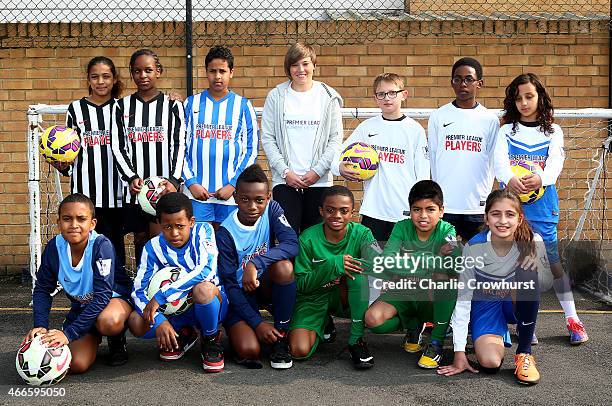 Fran Kirby poses for a photograph with the school children during the Premier League Players Kit Scheme Launch at Allen Edward Primary School on...