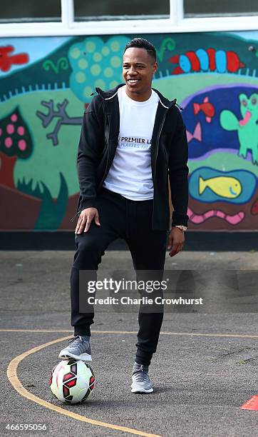 Nathaniel Clyne takes in activities with the school children during the Premier League Players Kit Scheme Launch at Allen Edward Primary School on...