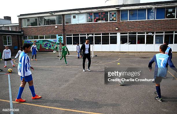 Nathaniel Clyne takes part in activities with the school children during the Premier League Players Kit Scheme Launch at Allen Edward Primary School...