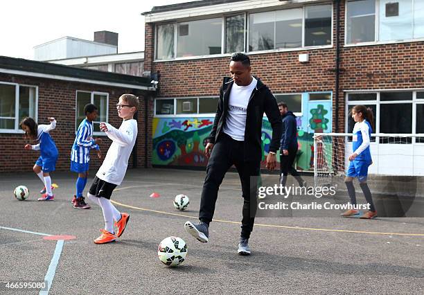 Nathaniel Clyne takes part in activities with the school children during the Premier League Players Kit Scheme Launch at Allen Edward Primary School...