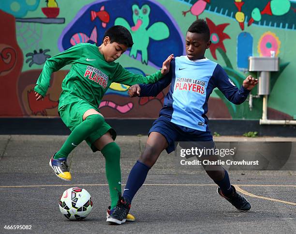 The school children take part in activities during the Premier League Players Kit Scheme Launch at Allen Edward Primary School on March 17, 2015 in...