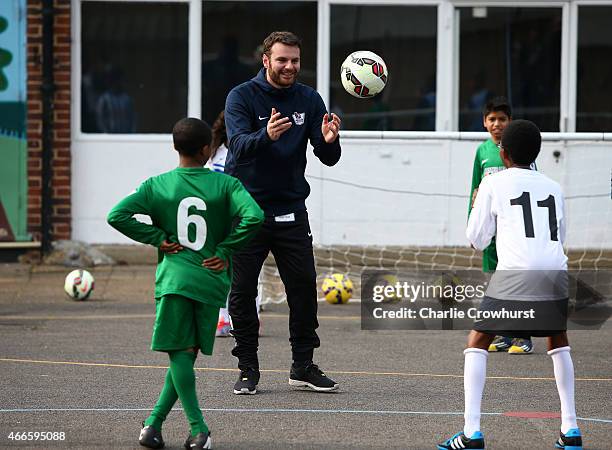 The school children take part in activities during the Premier League Players Kit Scheme Launch at Allen Edward Primary School on March 17, 2015 in...