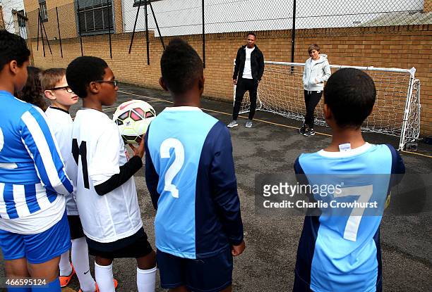 Nathaniel Clyne and Fran Kirby hold a Q & A with the children during the Premier League Players Kit Scheme Launch at Allen Edward Primary School on...
