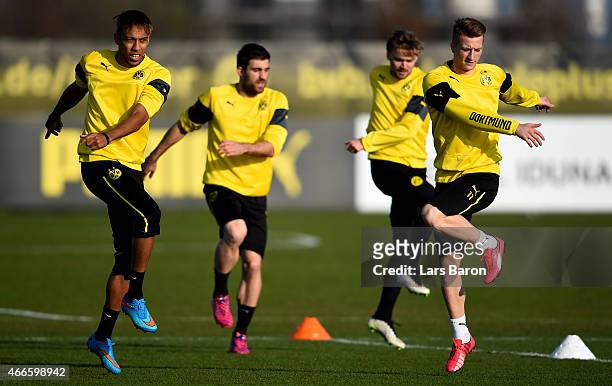 Pierre-Emerick Aubameyang, Sokratis Papastathopoulos, Marcel Schmelzer and Marco Reus warm up during a Borussia Dortmund training session at Signal...