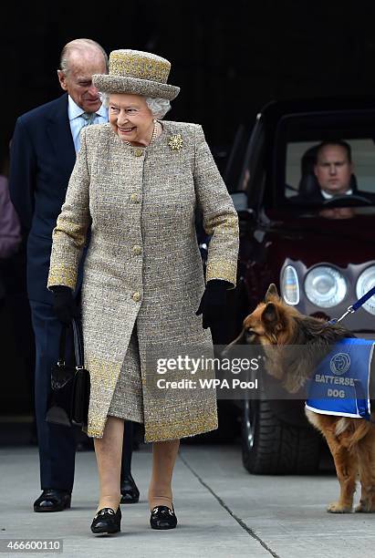 Britain's Queen Elizabeth II accompanied by Prince Philip, Duke of Edinburgh arrive to attend the opening of the new Mary Tealby dog kennels at...