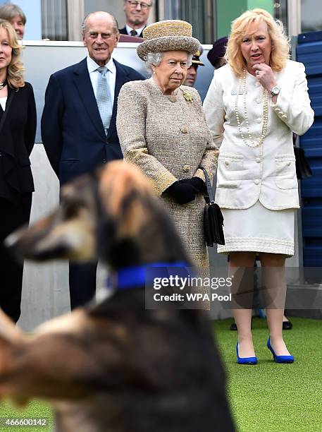 Britain's Queen Elizabeth II accompanied by Britain's Prince Philip, Duke of Edinburgh speak with Chief Executive Officer Claire Horton as they...