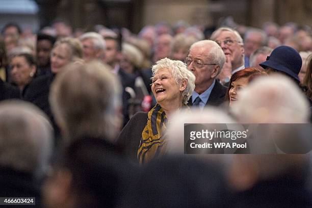 British actress Dame Judy Dench laughs at a joke made by Lord Puttnam at a service of thanksgiving for the life and work of Lord Attenborough CBE at...