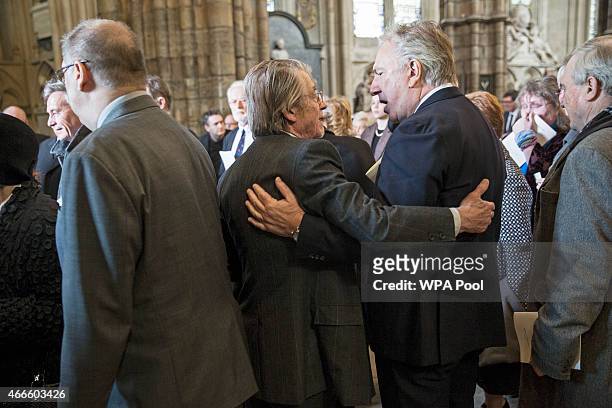 British actors John Hurt and Alan Rickman attend a service of thanksgiving for the life and work of Lord Attenborough CBE at Westminster Abbey on...