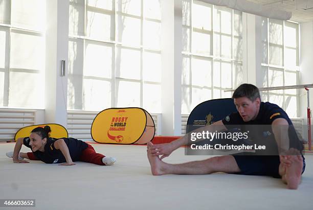 Gymnast Andreea Raducan with Rugby Player Ronan O'Gara warm up as they take on the DHL Rugby v's the World Challenge during the Rugby World Cup...