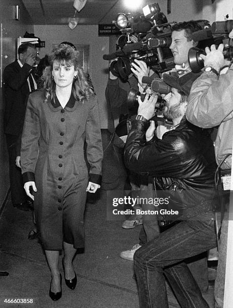 Pamela Smart walks past television cameras inside the Rockingham County Superior Court in Exeter, N.H., on March 21 during the second day of jury...