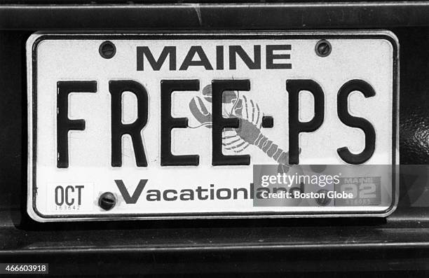 License plate carries a message, "FREE PS," from a Maine driver during a vigil outside Goffstown Prison on June 14 held by Friends of Pamela Smart, a...