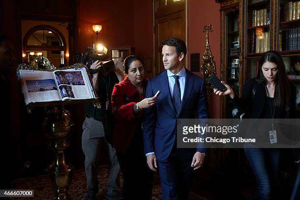 Congressman Aaron Schock speaks to the media as he arrives at an immigration reform panel hosted by the Illinois Business Immigration Coalition...
