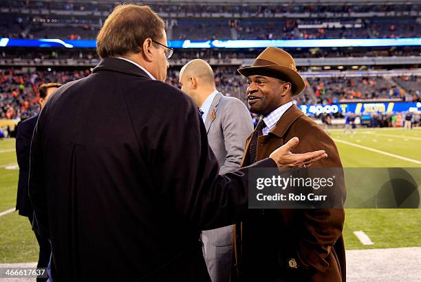 DeMaurice Smith , Executive Director of the NFLPA, talks with TV personality Chris Berman during Super Bowl XLVIII at MetLife Stadium on February 2,...