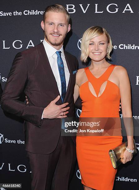 Actor Alexander Ludwig and actress Malin Akerman arrive at BVLGARI And Save The Children STOP. THINK. GIVE. Pre-Oscar Event at Spago on February 17,...