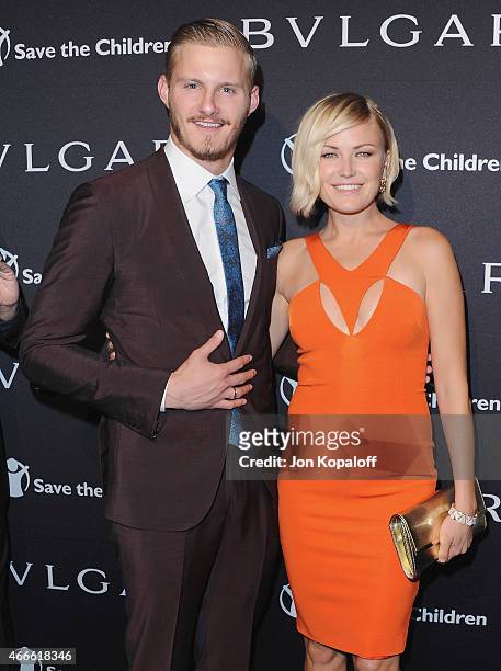Actor Alexander Ludwig and actress Malin Akerman arrive at BVLGARI And Save The Children STOP. THINK. GIVE. Pre-Oscar Event at Spago on February 17,...