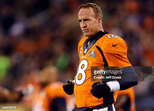 Quarterback Peyton Manning of the Denver Broncos looks on during warm-ups before playing against the Seattle Seahawks during Super Bowl XLVIII at...