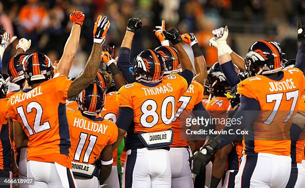 The Denver Broncos show camaraderie before playinga against the Seattle Seahawks during Super Bowl XLVIII at MetLife Stadium on February 2, 2014 in...