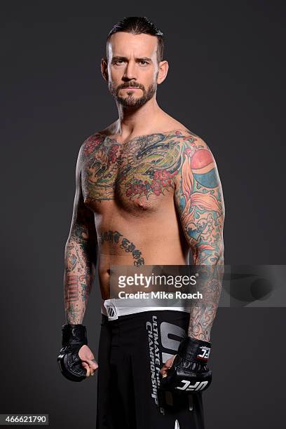 Phil "CM Punk" Brooks poses for a photo during a UFC photo session at the Hilton Anatole Hotel on March 13, 2015 in Dallas, Texas.