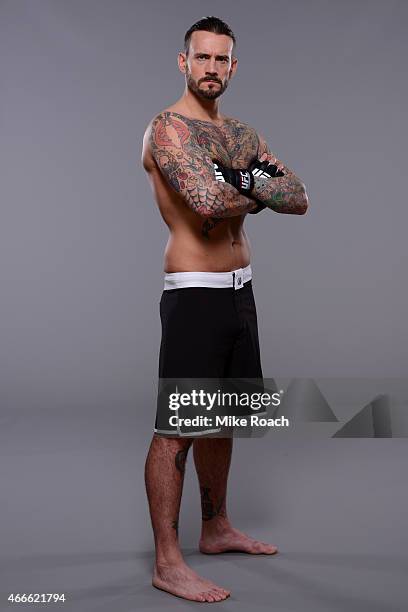 Phil "CM Punk" Brooks poses for a photo during a UFC photo session at the Hilton Anatole Hotel on March 13, 2015 in Dallas, Texas.