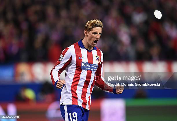 Fernando Torres of Atletico Madrid celebrates scoring in the penalty shoot out during the UEFA Champions League round of 16 match between Club...