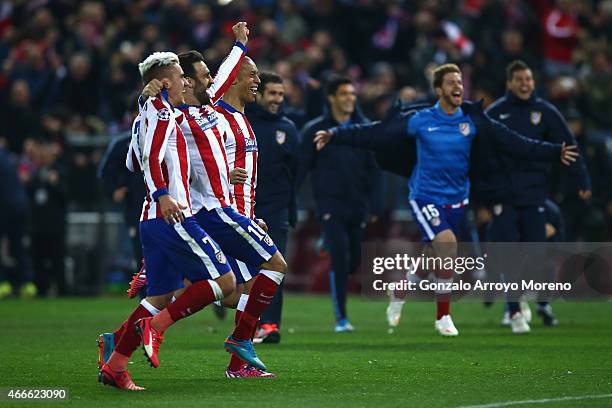Antoine Griezmann and Jesus Gamez of Atletico Madrid celebrate victory after the penalty shoot out during the UEFA Champions League round of 16 match...