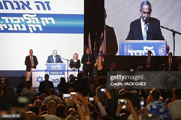 Israeli Prime Minister Benjamin Netanyahu delivers a speech as he reacts to exit poll figures in Israel's parliamentary elections late on March 17,...