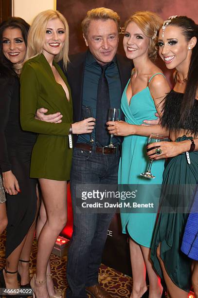 Michael Flatley poses with female dancers at the after party following the Gala Performance of "Lord Of The Dance: Dangerous Games" at The Dominion...
