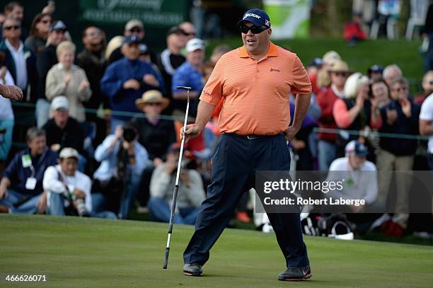 Kevin reacts on the 18th hole during the final round of the Waste Management Phoenix Open at TPC Scottsdale on February 2, 2014 in Scottsdale,...