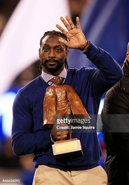 Charles Tillman wins Walter Payton NFL Player of Year trophy prior to Super Bowl XLVIII at MetLife Stadium on February 2, 2014 in East Rutherford,...