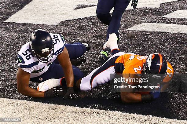 Running back Knowshon Moreno of the Denver Broncos recovers the ball in the endzone for a safety against the Seattle Seahawks during the first...