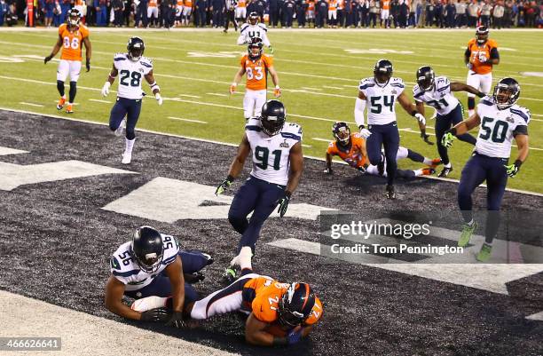 Running back Knowshon Moreno of the Denver Broncos recovers the ball in the endzone for a safety against the Seattle Seahawks during the first...