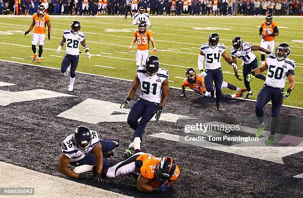 Running back Knowshon Moreno of the Denver Broncos recovers the ball in the endzone for a safety against the Seattle Seahawks during the first...