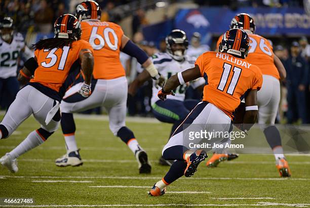 Denver Broncos wide receiver Trindon Holliday returns the kick off during the first quarter. The Denver Broncos vs the Seattle Seahawks in Super Bowl...