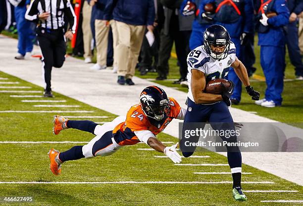 Wide receiver Doug Baldwin of the Seattle Seahawks runs with ball for a 37 yard pass completion during the first quarter of Super Bowl XLVIII against...