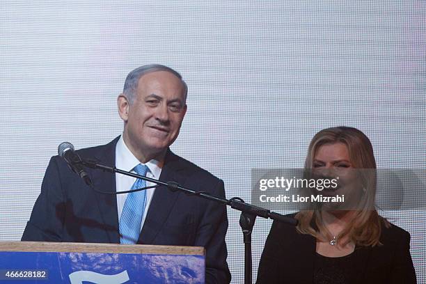 Israeli Prime Minister Benjamin Netanyahu speaks to his supporters next to his wife Sara at his election campaign headquarters on March 17, 2015 in...