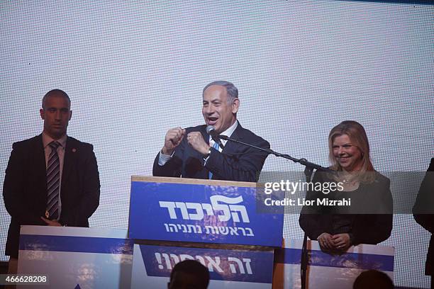 Israeli Prime Minister Benjamin Netanyahu speaks to his supporters next to his wife Sara at his election campaign headquarters on March 17, 2015 in...