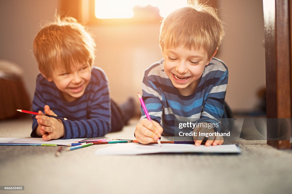 Little brothers enjoying drawing together