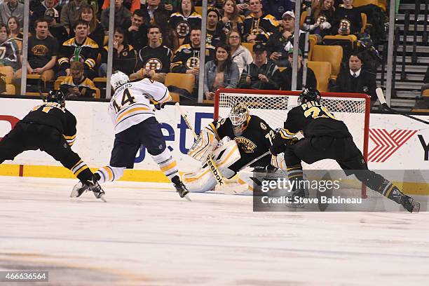 Niklas Svedberg of the Boston Bruins makes a save against Nicholas Deslauriers of the Buffalo Sabres at the TD Garden on March 17, 2015 in Boston,...