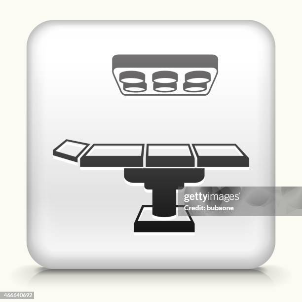 square button with operating table interface icon - doctors exam table stock illustrations