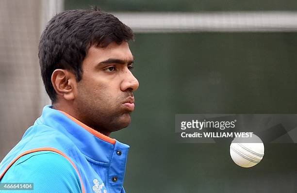 Indian spinner Ravi Ashwin prepares to bowl during a training session ahead of their 2015 Cricket World Cup quarter-final match against Bangladesh in...