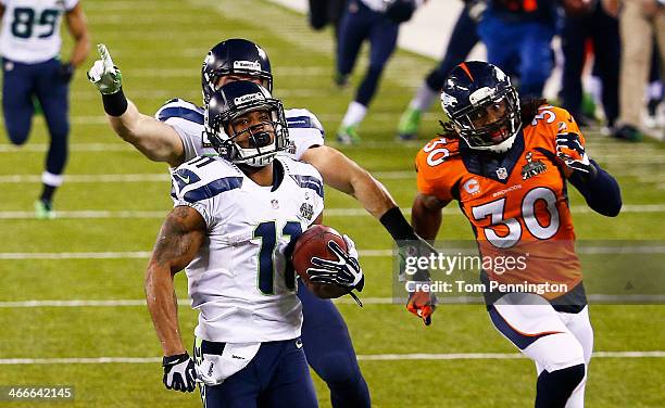 Wide receiver Percy Harvin of the Seattle Seahawks returns the second half kickoff for 87 yards during Super Bowl XLVIII at MetLife Stadium against...